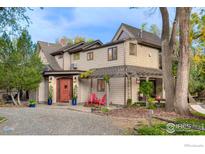 Two-story house with a covered entryway and landscaping at 3737 26Th St, Boulder, CO 80304