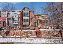 3-story brick home with unique architectural details at 487 Pearl St, Boulder, CO 80302