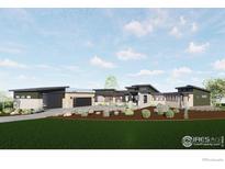 Modern home with a green exterior, two-car garage, and landscaped yard at 2664 Southwind Rd, Berthoud, CO 80513