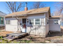 Quaint single-story home with a wooden walkway at 1709 Arapahoe Ave, Boulder, CO 80302