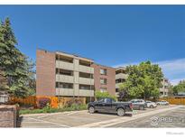 Exterior of an apartment building with ample parking at 2227 Canyon Blvd # 158, Boulder, CO 80302