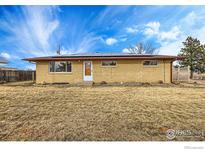 Ranch style home with solar panels and a spacious yard at 3520 W County Road 8, Berthoud, CO 80513