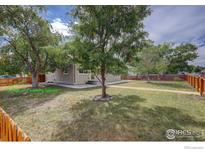 Ranch home with a fenced yard, and off-street parking at 1980 Ruth Dr, Thornton, CO 80229