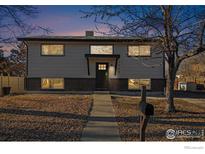 Updated Ranch home exterior boasts a fresh coat of paint and landscaping at 1644 Nueva Vista Dr, Denver, CO 80229