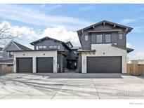 Three-unit modern building with attached garages and sleek design at 415 East St # A, Louisville, CO 80027