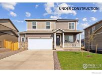 New construction two-story home with front porch and attached garage at 4213 Sandstone Dr, Mead, CO 80504