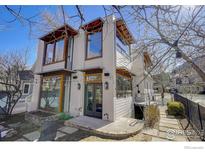 Modern two-story home with white exterior and large windows at 465 Marine St, Boulder, CO 80302