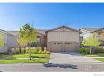 Ranch style home with two-car garage and landscaped front yard at 22646 E Glidden Dr, Aurora, CO 80016