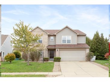 Two story house exterior with brick and vinyl siding at 5321 Basin Park Dr, Indianapolis, IN 46239