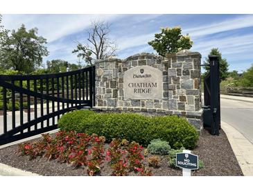 Chatham Ridge community entrance with stone pillars and black gate at 1366 Forest Hills Dr, Westfield, IN 46074