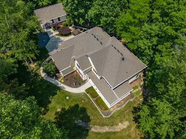 Aerial view of two-story house nestled in a wooded area at 1104 W Greencastle Road, Mooresville, IN 46158
