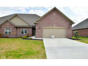 Brick ranch home with 2-car garage and landscaped lawn at 2749 Stones Bay Dr, Greenwood, IN 46143