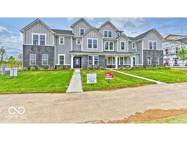 Two-story townhome with gray siding and landscaping at 5715 Cr W 750 N, McCordsville, IN 46055