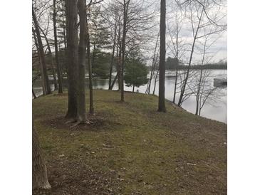 Wooded lakefront lot with gentle slope and access to the water at 3931 N Foxcliff W Dr, Martinsville, IN 46151