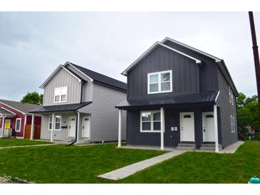 Two new construction homes; one gray, one dark gray, with a modern farmhouse style at 1818 Ingram St, Indianapolis, IN 46218