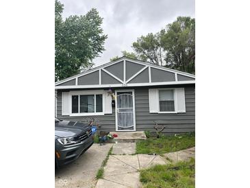 Gray house with white trim and a security door at 533 Lynn St, Indianapolis, IN 46222