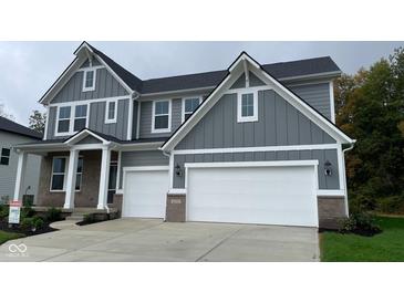 Two-story house with gray siding, white trim, and a two-car garage at 6272 Willow Branch Way, Plainfield, IN 46168