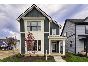 Modern farmhouse exterior with gray and white siding at 1340 English Ave, Indianapolis, IN 46203