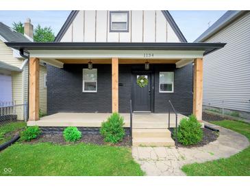Charming house with a covered porch and landscaping at 1134 St Peter St, Indianapolis, IN 46203