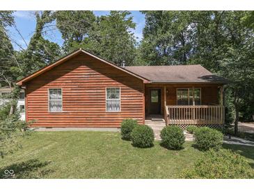 Rustic wooden house with a small porch and yard at 8157 Center Lake Rd, Nineveh, IN 46164