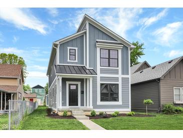 Modern two-story home with gray siding and metal roof at 220 Sanders St, Indianapolis, IN 46225
