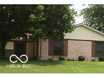 Brick ranch home with brown accents and a well-maintained lawn at 14 Winchester Ct, Anderson, IN 46013