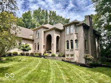 Large brick house with landscaped yard at 5300 W Autumn Springs Ct, Muncie, IN 47304