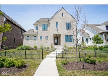 Brick house with a walkway and black fence at 1453 Andante Way, Westfield, IN 46074