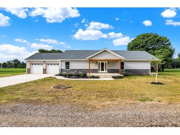 Ranch-style home with stone and wood accents at 10614 N 300 E, Morristown, IN 46161