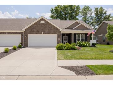 Brick ranch home with 2-car garage and landscaped yard at 8739 Faulkner Dr, Indianapolis, IN 46239