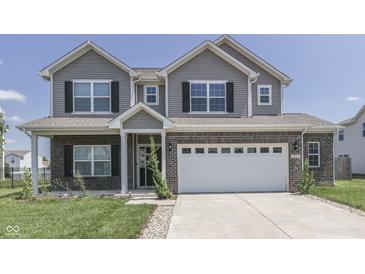 Two-story house with gray siding, brick accents, and a two-car garage at 2277 Maple Stone Ln, Greenwood, IN 46143