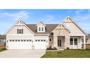 Craftsman style home with stone accents and a three-car garage at 15798 Vitalize Run, Fishers, IN 46040