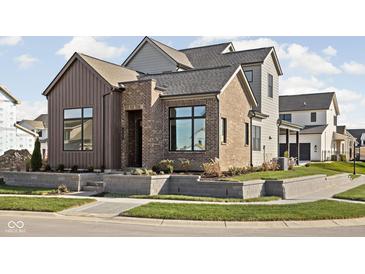 Modern two-story home with brick and wood exterior at 17327 Newton Main St, Westfield, IN 46074