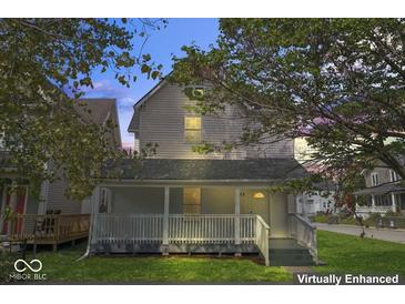 Charming two-story home with front porch at 248 N Walcott N St, Indianapolis, IN 46201