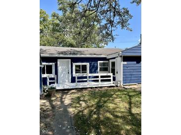 Blue house with white trim and a small porch at 2813 Collier St, Indianapolis, IN 46241