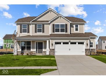Two-story house featuring a neutral color scheme, stone accents, and a two-car garage at 4168 Dutton Dr, Bargersville, IN 46106