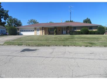 Ranch-style home with a double car garage at 610 W Monroe St, Alexandria, IN 46001