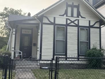 Quaint Craftsman home with white siding and black trim at 1804 N Delaware St, Indianapolis, IN 46202