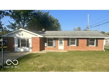 Brick ranch house with a well-kept lawn at 6733 S Cross St, Pendleton, IN 46064