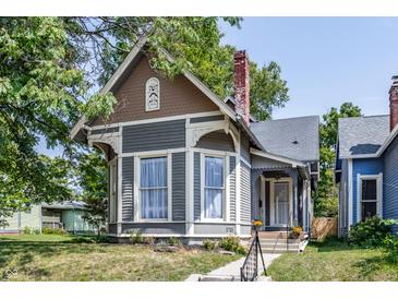 Gray and brown Victorian home with a charming front porch at 1715 Alabama St, Indianapolis, IN 46202