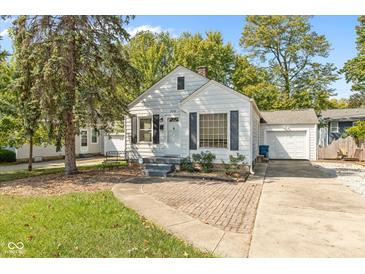 Quaint white house with brick walkway and driveway at 5648 N Keystone Ave, Indianapolis, IN 46220