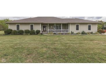 Ranch style home with covered porch and landscaping at 5391 Neff Ln, Mooresville, IN 46158