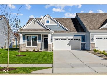 Two-story Craftsman home with gray siding, stone accents, and a two-car garage at 10618 Maidenhair Dr, Indianapolis, IN 46239