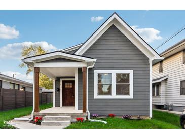 Charming craftsman bungalow with gray siding and front porch at 847 Lincoln St, Indianapolis, IN 46203