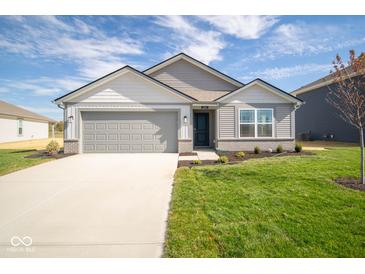 Two-story home with gray siding and attached garage at 1114 Fleming Dr, Greenfield, IN 46140