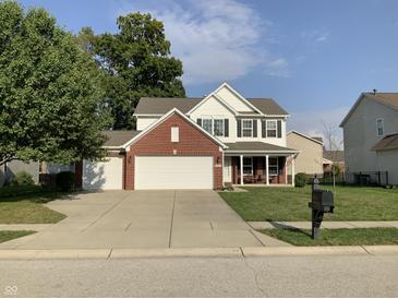 Two-story brick house with a two-car garage at 5211 Nicodemus Dr, Plainfield, IN 46168