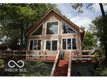 A-frame lake house with large windows and a deck at 7477 Honey Locust Dr, Nineveh, IN 46164