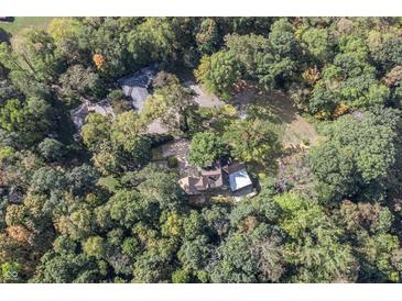Aerial view of house and surrounding trees at 6470 Around The Hills Rd, Indianapolis, IN 46226
