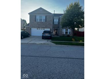 Two-story brick home with a two-car garage at 1449 Danielle Dr, Indianapolis, IN 46231