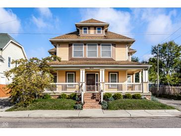Two story house with front porch and brick steps at 814 E 23Rd St, Indianapolis, IN 46205